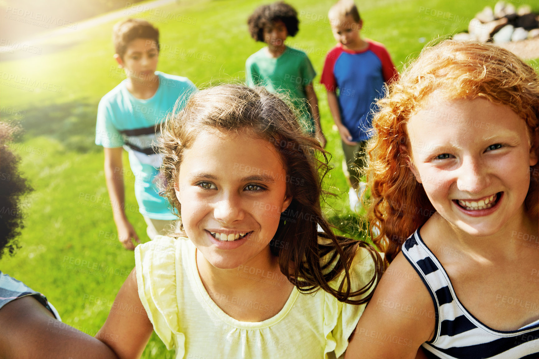 Buy stock photo Portrait of a group of diverse and happy kids hanging out together outside