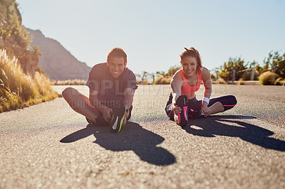 Buy stock photo Full length shot of two young people warming up before their workout