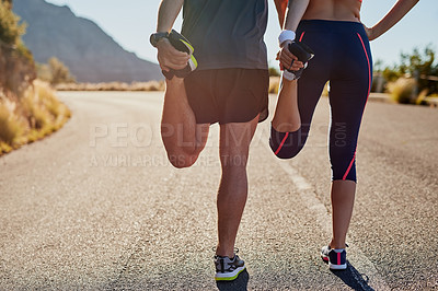 Buy stock photo Rearview shot of two unrecognizable young people warming up before a workout