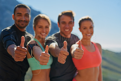 Buy stock photo Cropped shot of a fitness group showing thumbs up
