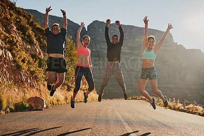 Buy stock photo Shot of a fitness group celebrating after a good workout