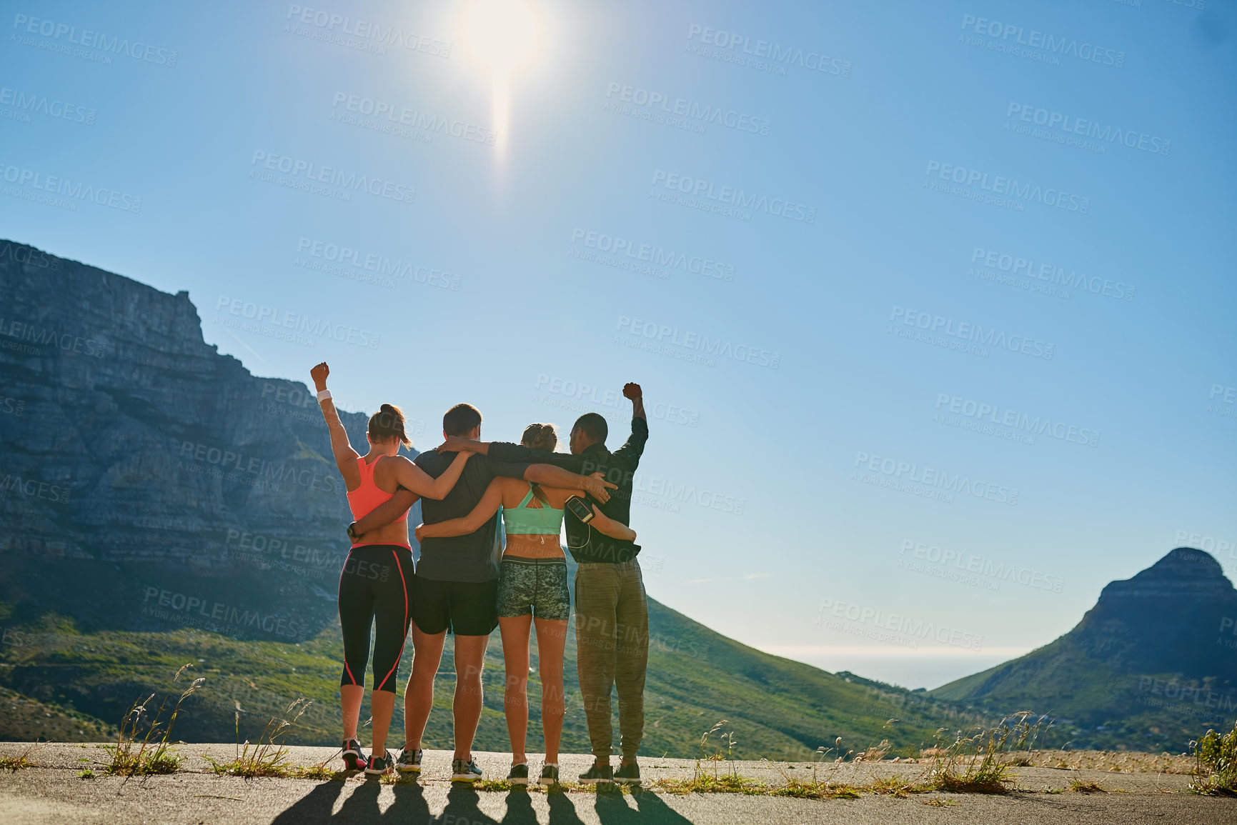 Buy stock photo Shot of a fitness group celebrating after a good workout