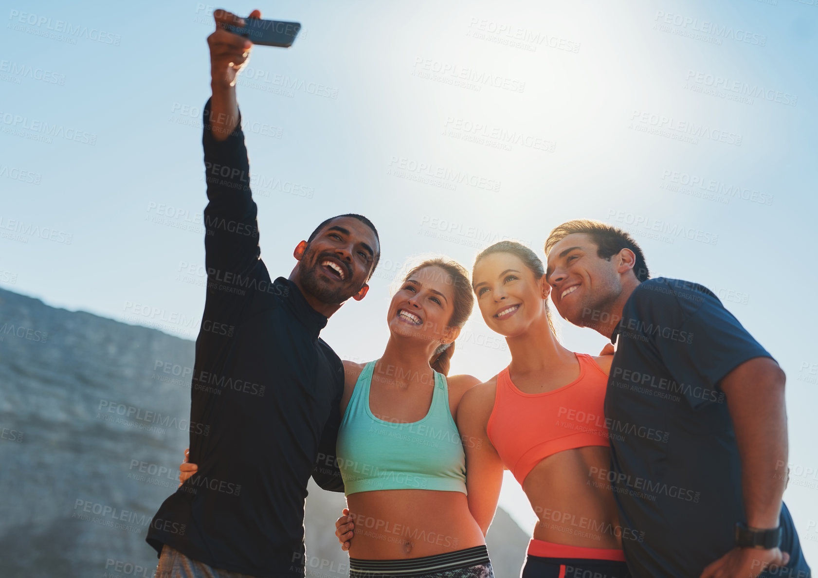 Buy stock photo Shot of a group of friends taking a selfie while out for a workout