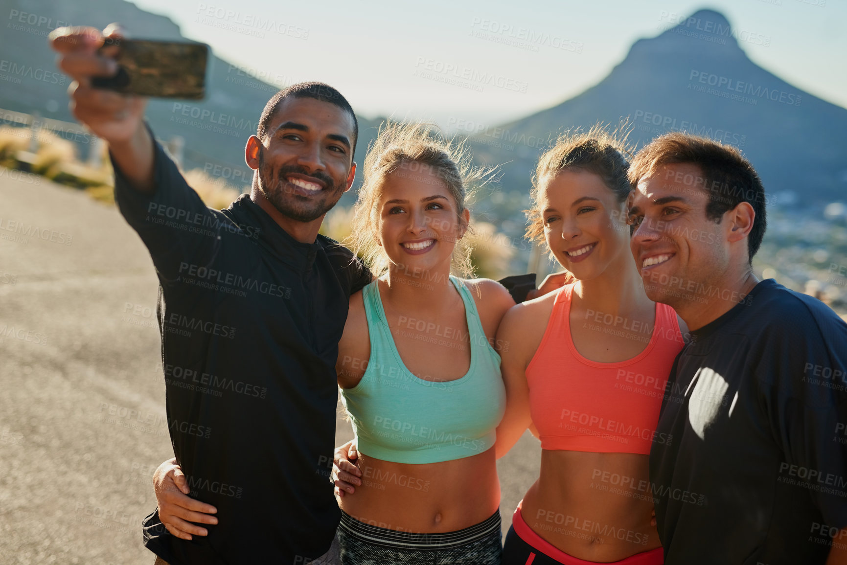 Buy stock photo Shot of a group of friends taking a selfie while out for a workout