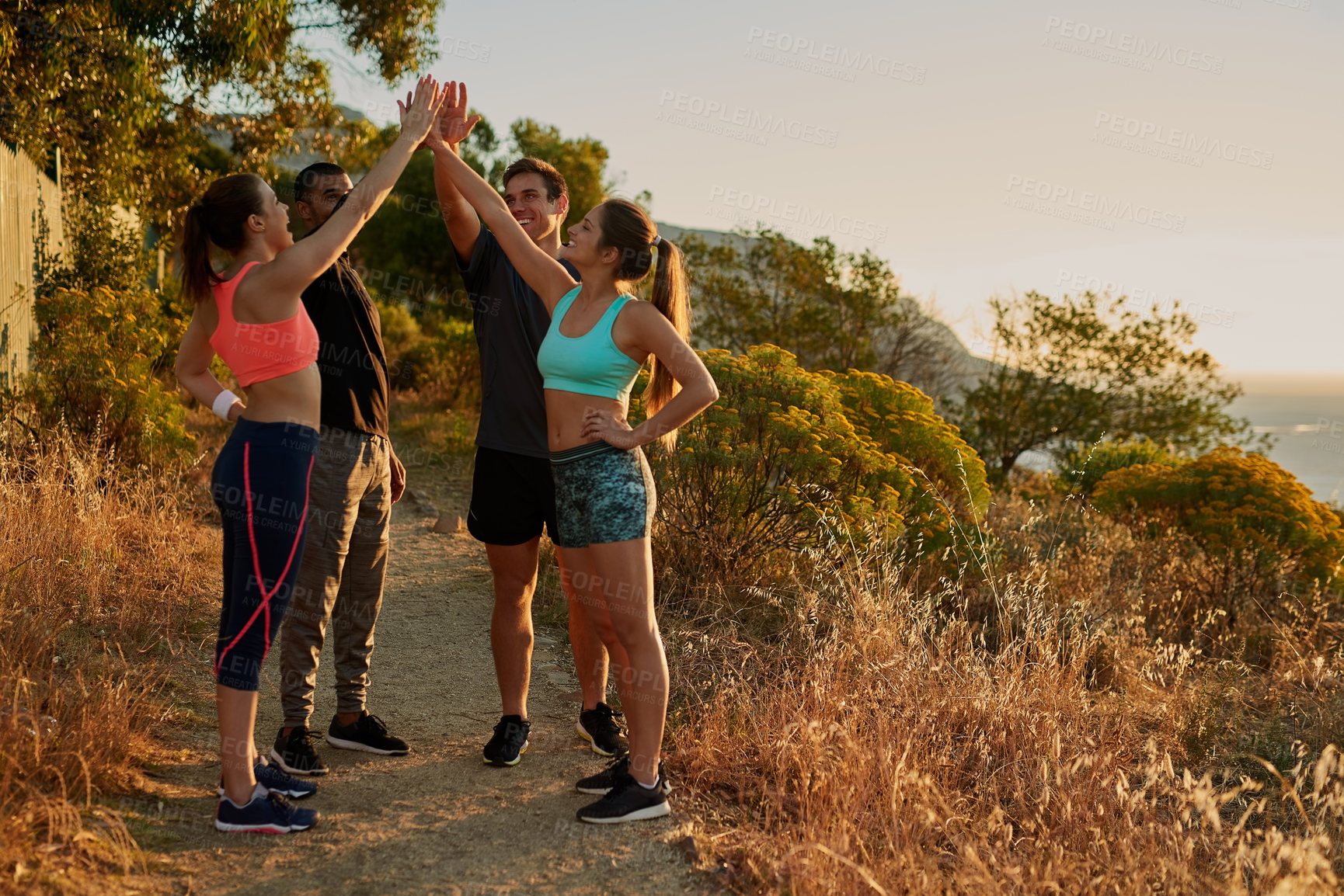 Buy stock photo People, group and high five or mountain exercise as trail running support, fitness or victory. Men, women and hand gesture for training goals or sport target or friends celebration, morning or nature