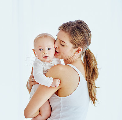 Buy stock photo Cropped shot of a mother bonding with her adorable baby boy at home