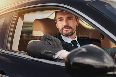 Buy stock photo Cropped portrait of a handsome businessman on his morning commute to work