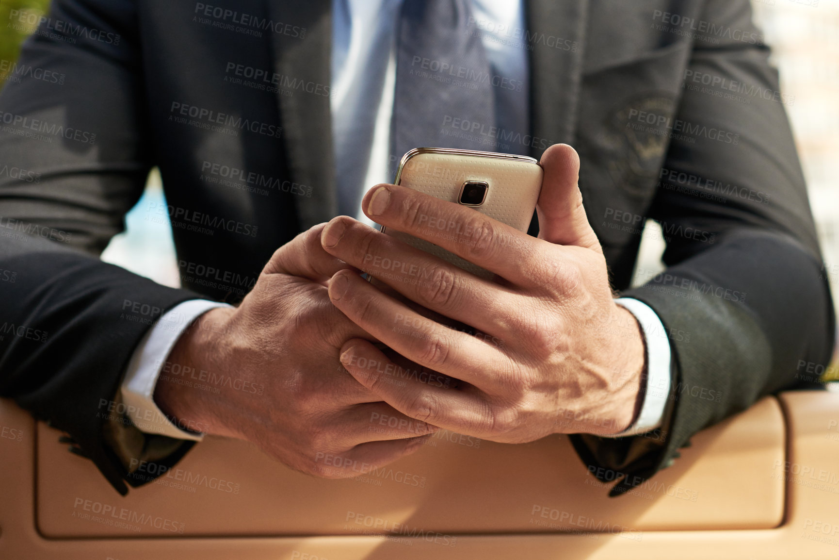 Buy stock photo Businessman, hands and typing with phone for travel, commute or app on navigation or destination in city. Closeup of man or driver on mobile smartphone for location, road trip or journey in town