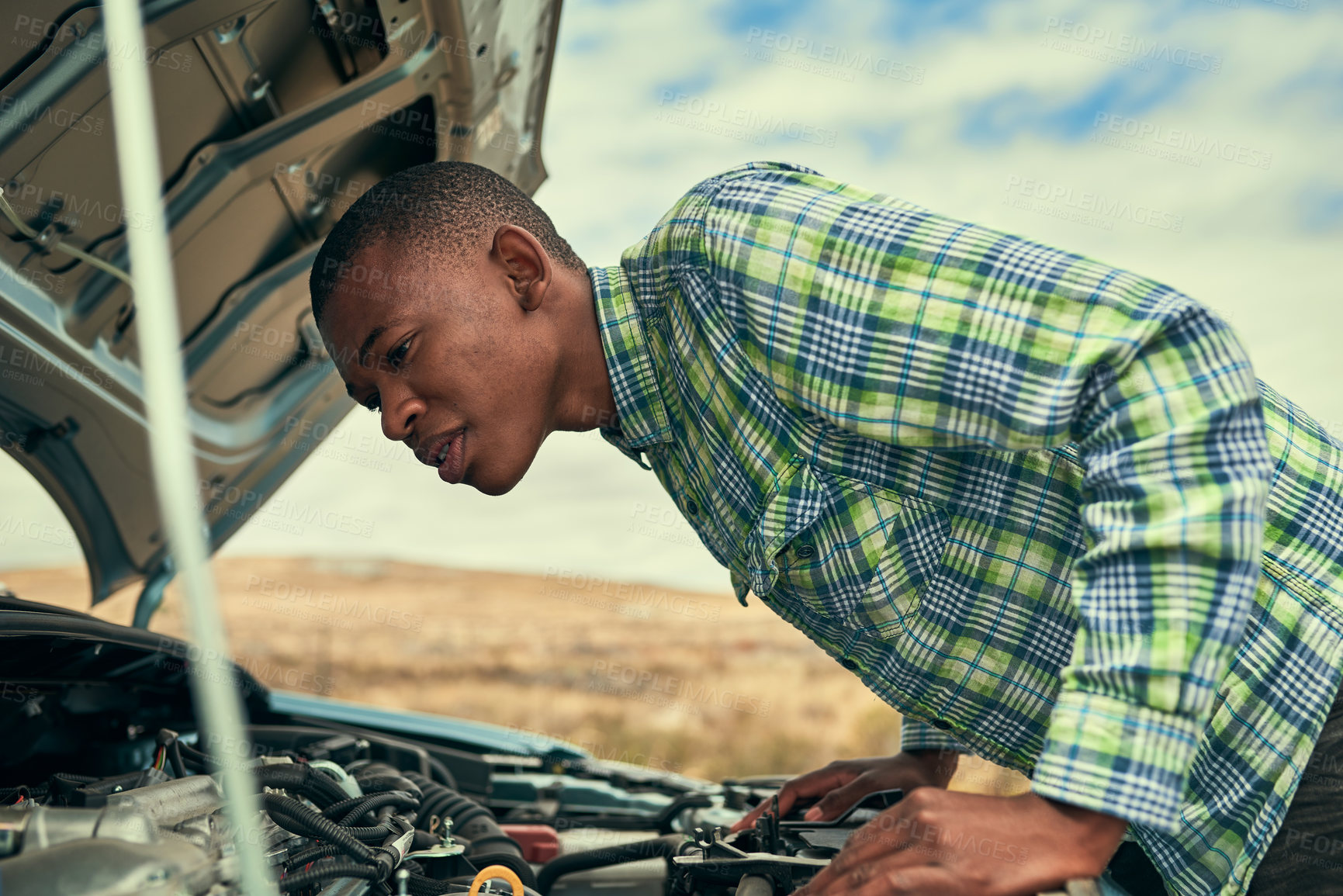 Buy stock photo Black man, engine and check car issue on road, hood and roadside assistance for auto service. Male person, battery and power issue with vehicle on street, cables and driver for transport emergency