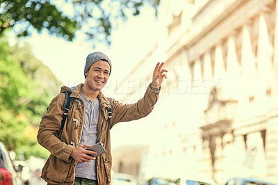 Buy stock photo Asian man, city and hand hail or travel transportation with cellphone for taxi app, commute or tourism. Male person, smartphone and location journey or outdoor guide for holiday, explore or urban