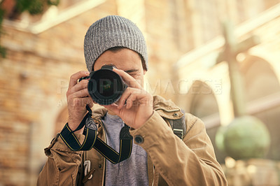 Buy stock photo Portrait of a young man taking photos on his camera outside