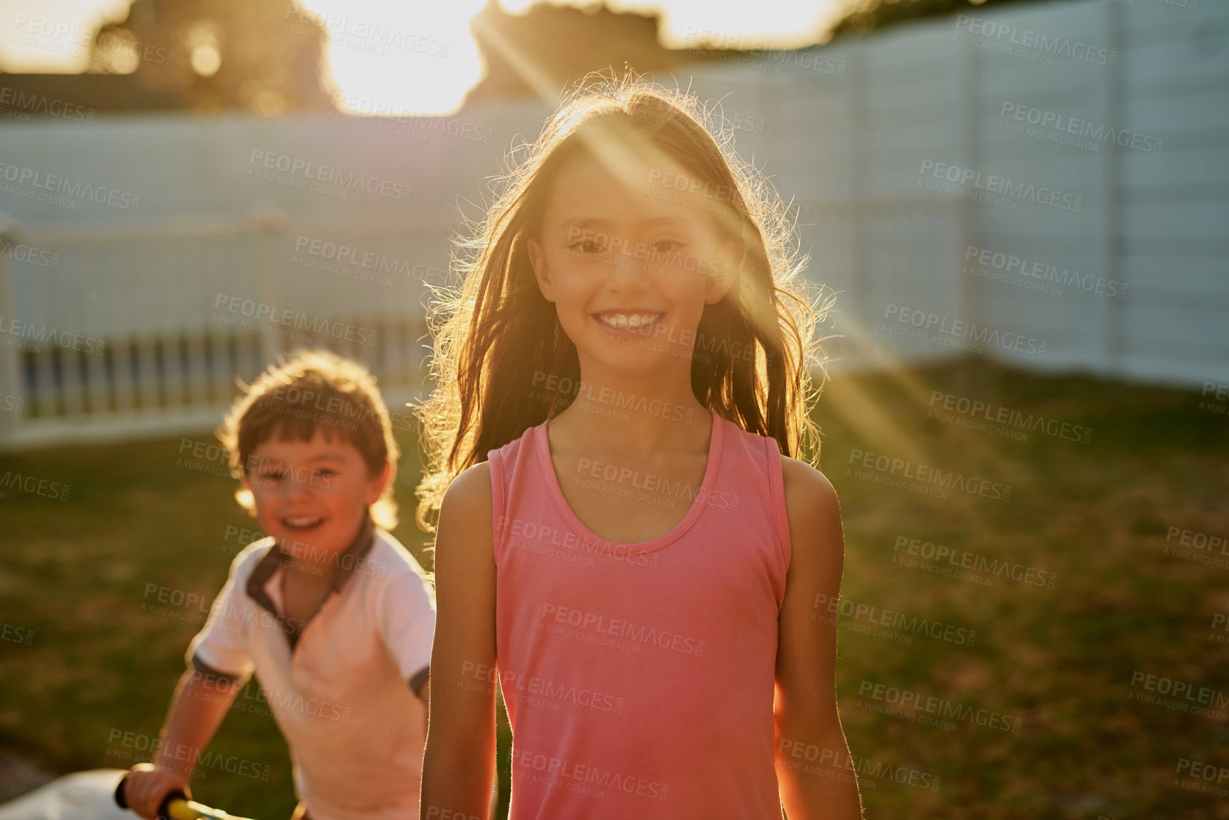 Buy stock photo Boy, girl and children in backyard for portrait, playing and happy with bonding, love and care on lawn. Family, sister and brother with smile, excited and holiday with games, outdoor and sunshine