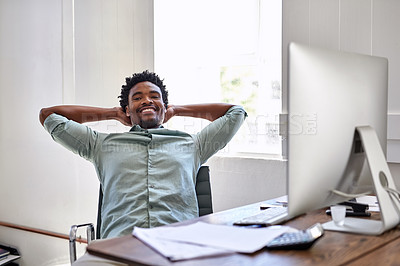 Buy stock photo Portrait of a young designer taking a break at his office desk
