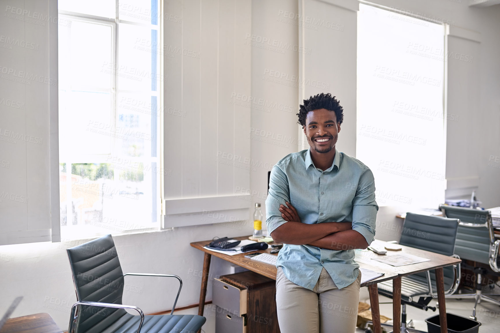 Buy stock photo Portrait of a confident young designer standing in an office