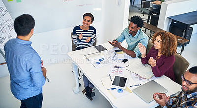 Buy stock photo Cropped shot of a team of designer applauding during a presentation in an office