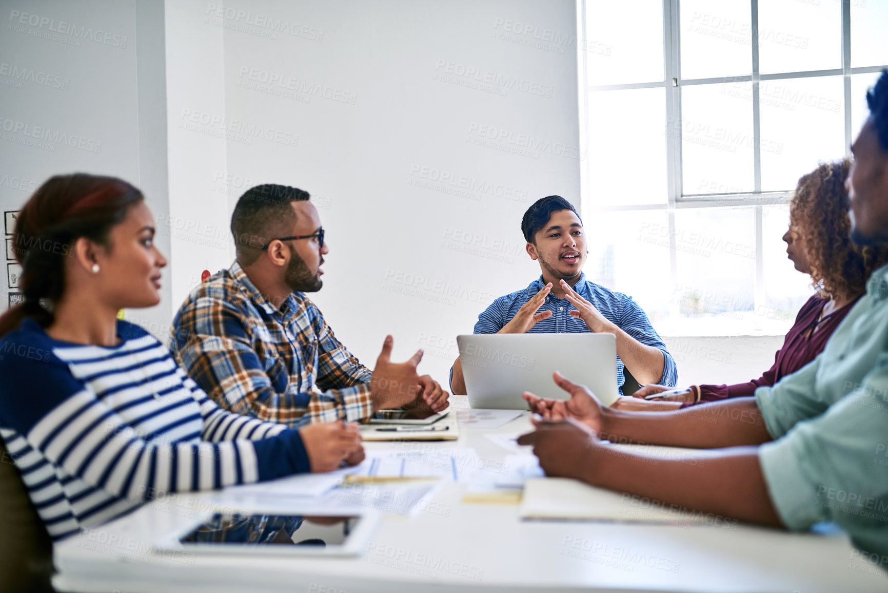 Buy stock photo Cropped shot of a team of designers brainstorming together in an office