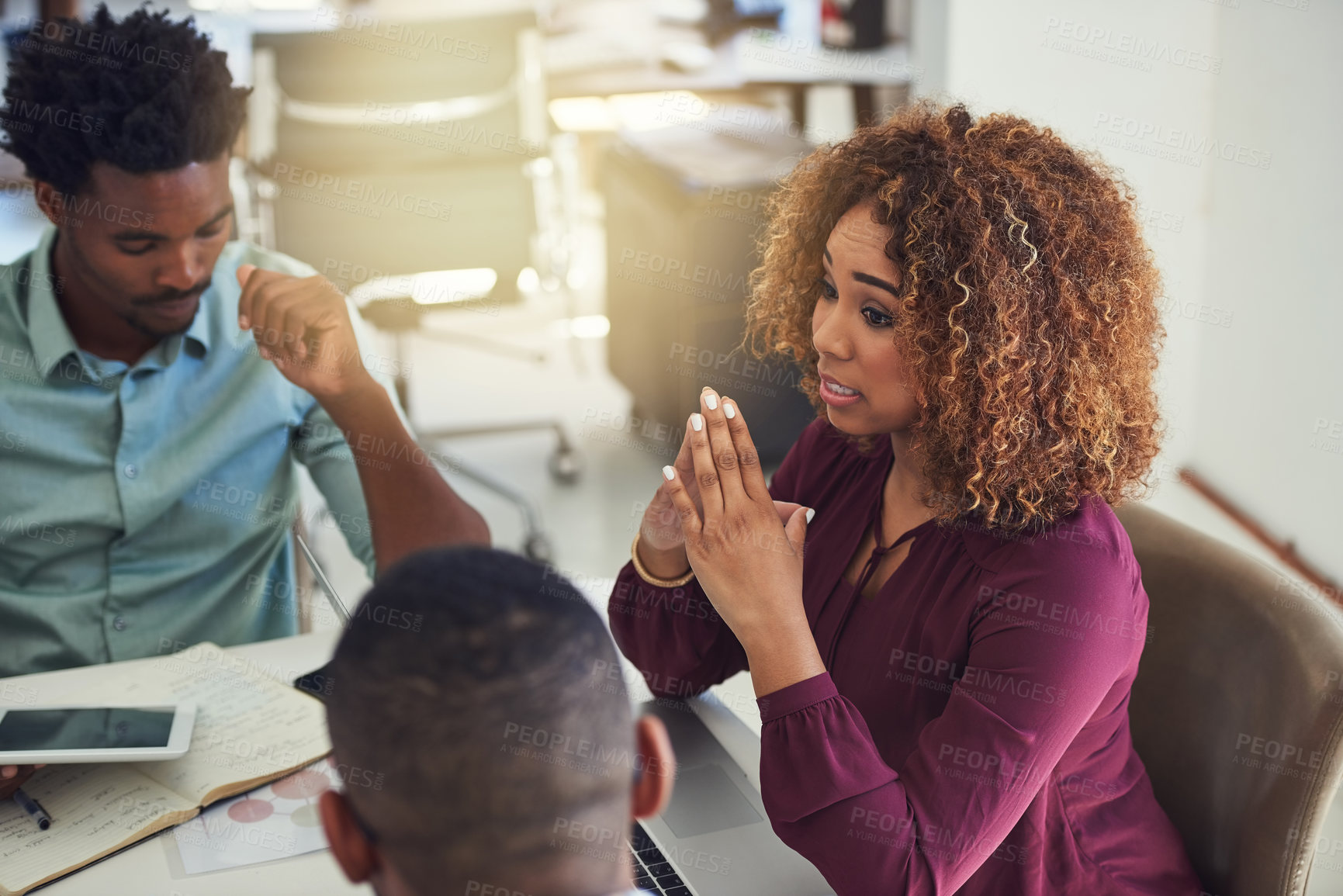 Buy stock photo Cropped shot of a team of designers brainstorming together in an office