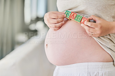 Buy stock photo Pregnant, stomach and woman with baby blocks for maternity care, motherhood and wellness in home. Family, pregnancy and hands of person with wooden toys for child development, growth and health