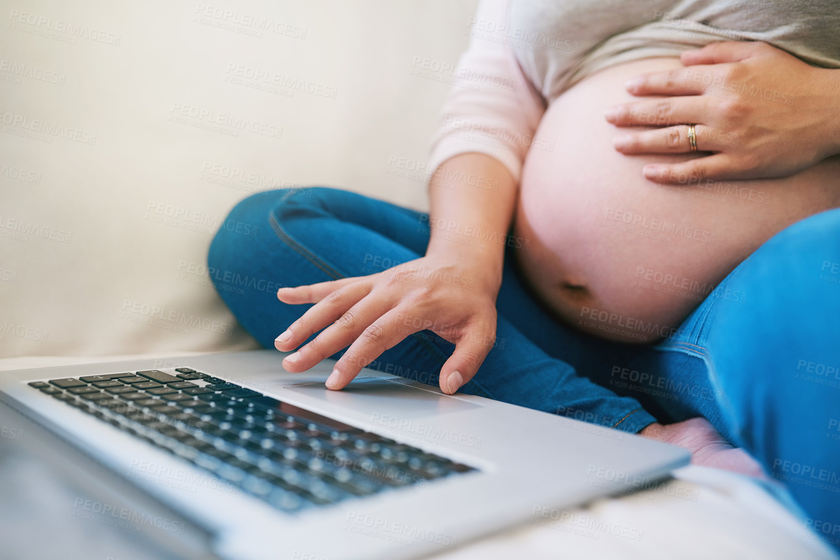 Buy stock photo Remote work, pregnant and woman with laptop on sofa for maternity leave, working from home and career. Pregnancy, and hands of person on computer for parenting website, research and online shopping