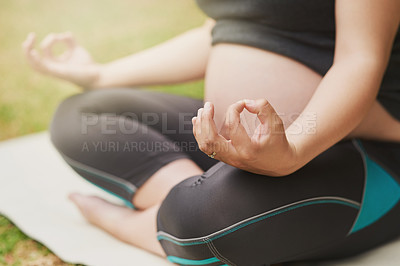 Buy stock photo Cropped shot of an unrecognizable young pregnant woman meditating outside