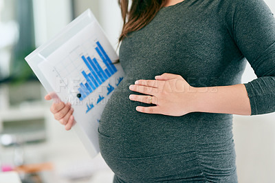 Buy stock photo Cropped shot of an unrecognizable pregnant woman working at home
