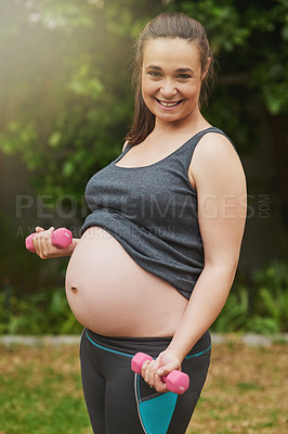 Buy stock photo Cropped portrait of an attractive young pregnant woman exercising outside