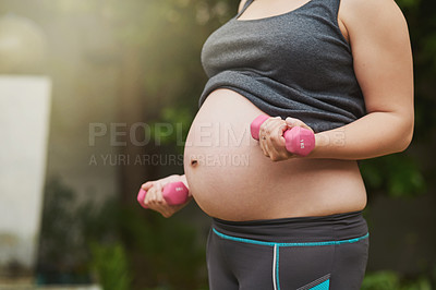 Buy stock photo Cropped shot of an unrecognizable pregnant woman exercising outside