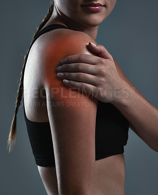 Buy stock photo Fitness, hand and woman with shoulder pain from accident, inflammation and red glow in studio. Female athlete, arm injury and massage for relief from arthritis, tension and care on dark background