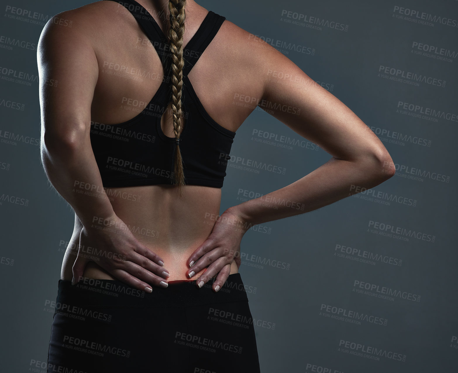 Buy stock photo Back pain, woman and fitness with injury, tired and inflammation on grey studio background. Person, athlete and model with red, medical risk or sports burnout with workout, wellness or muscle tension