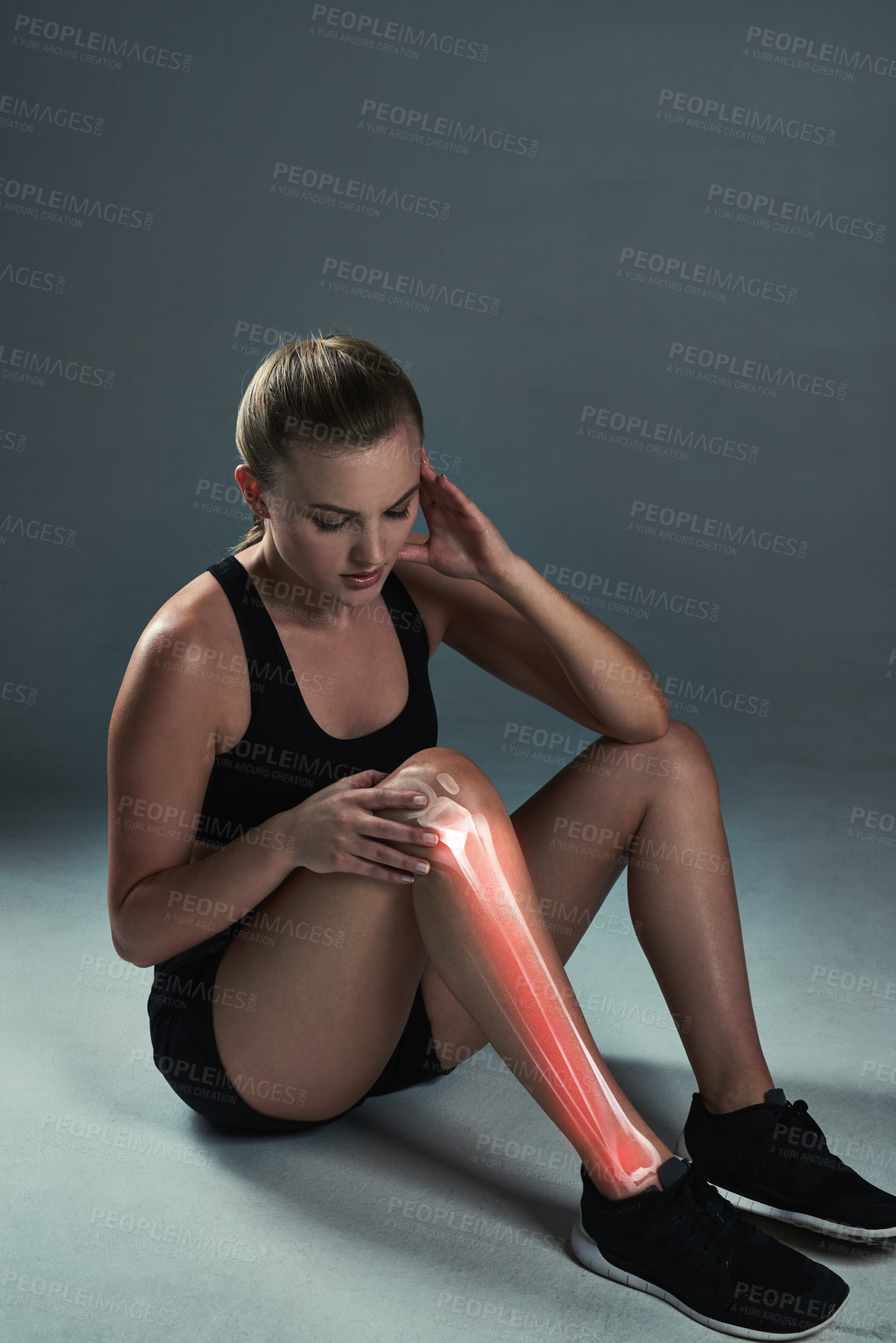 Buy stock photo Fitness, knee pain and woman in studio on floor for joint injury, emergency or workout accident on gray background. Double exposure, runner and athlete for discomfort, anatomy problem or broken bone