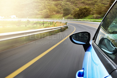 Buy stock photo Car, driving and travel on highway road trip, journey and location with speed towards bend. Rear mirror, commute and moving fast on street for scenic route with vehicle, performance and cruise