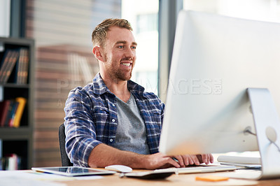 Buy stock photo Cropped shot of a young designer working on a computer in an office