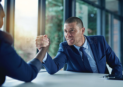 Buy stock photo Cropped shot of two businesspeople arm wrestling in the office