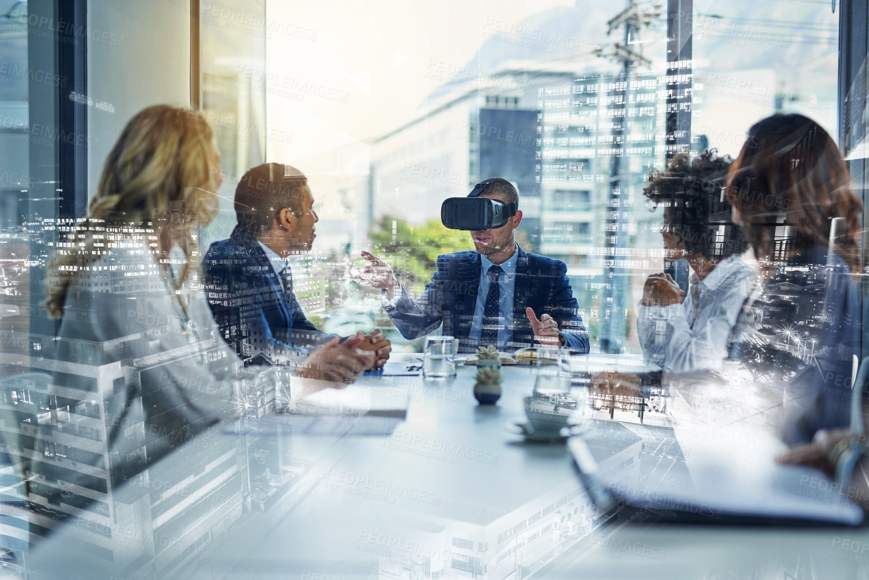 Buy stock photo Shot of a businessman wearing a VR headset during a meeting in the boardroom