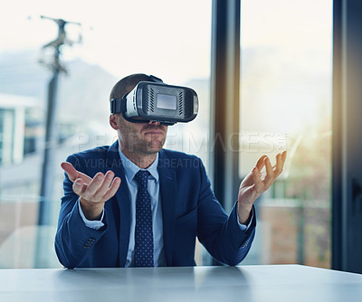 Buy stock photo Cropped shot of businessman wearing a VR headset in the office