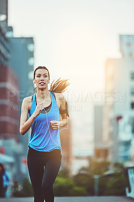 Buy stock photo Woman, street and running for exercise with earphones, music streaming app and phone in morning. Girl, person or runner with audio, radio or listen on subscription in workout on road in San Francisco