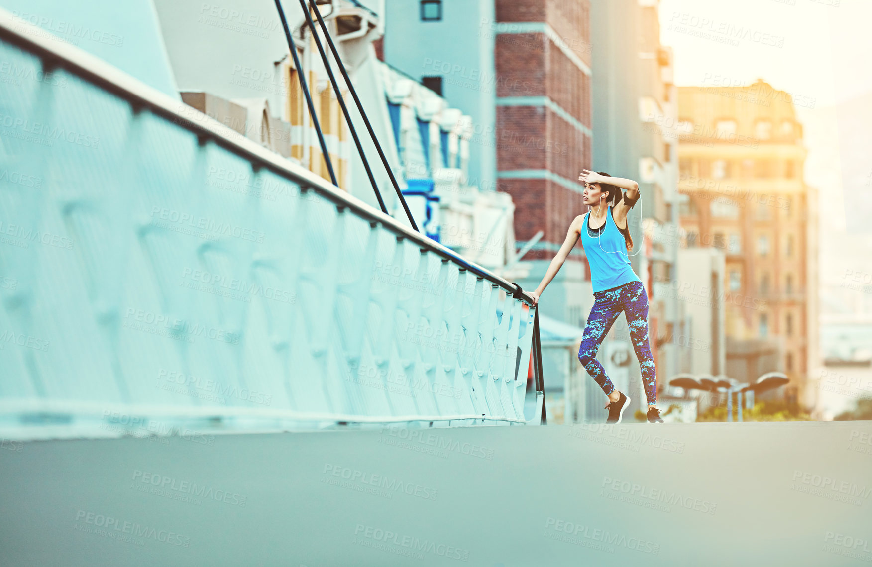 Buy stock photo Shot of a young woman looking exhausted during her morning run