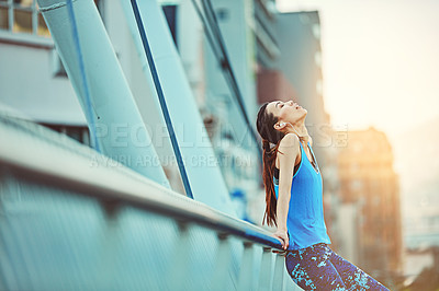 Buy stock photo Shot of a young woman looking exhausted during her morning run
