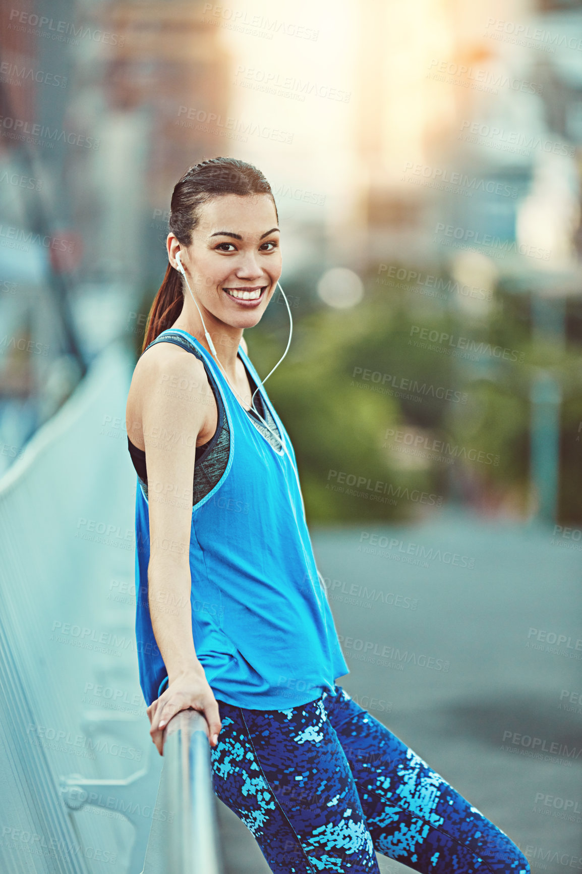 Buy stock photo Shot of young woman working out in the city