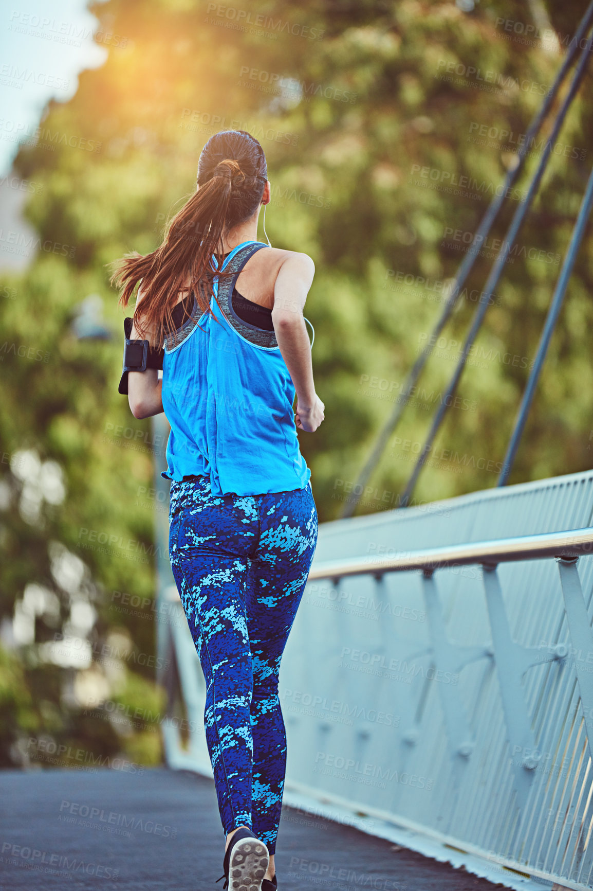 Buy stock photo Back, running and woman on bridge for fitness, training and exercise for wellness. Outdoor, female person and runner for workout, muscle development and endurance with health challenge in New York