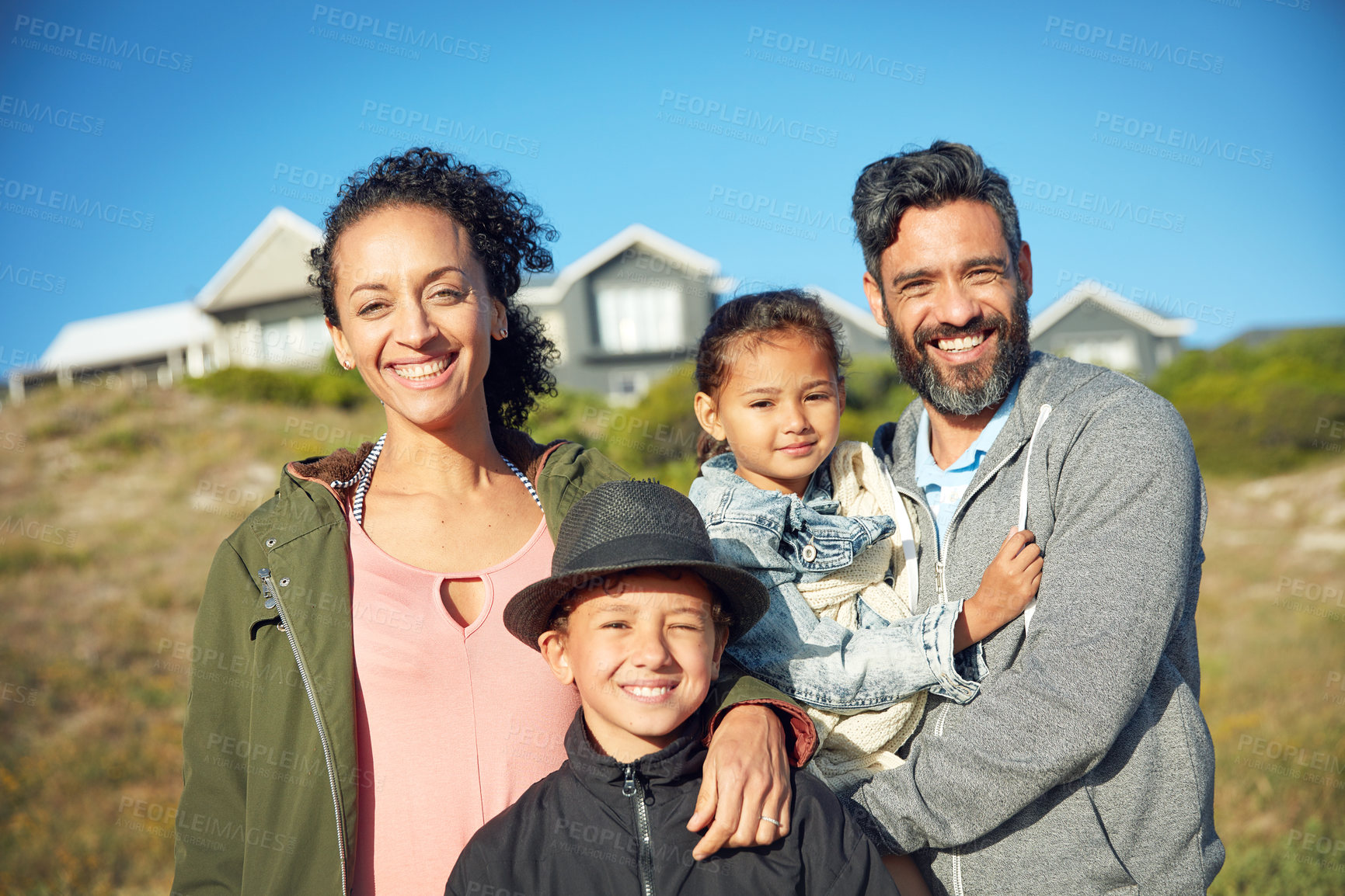 Buy stock photo Vacation, house and outdoor portrait of family with smile, nature and bonding together on travel adventure. Mom, dad and children on summer holiday in backyard with blue sky, happy face and sunshine