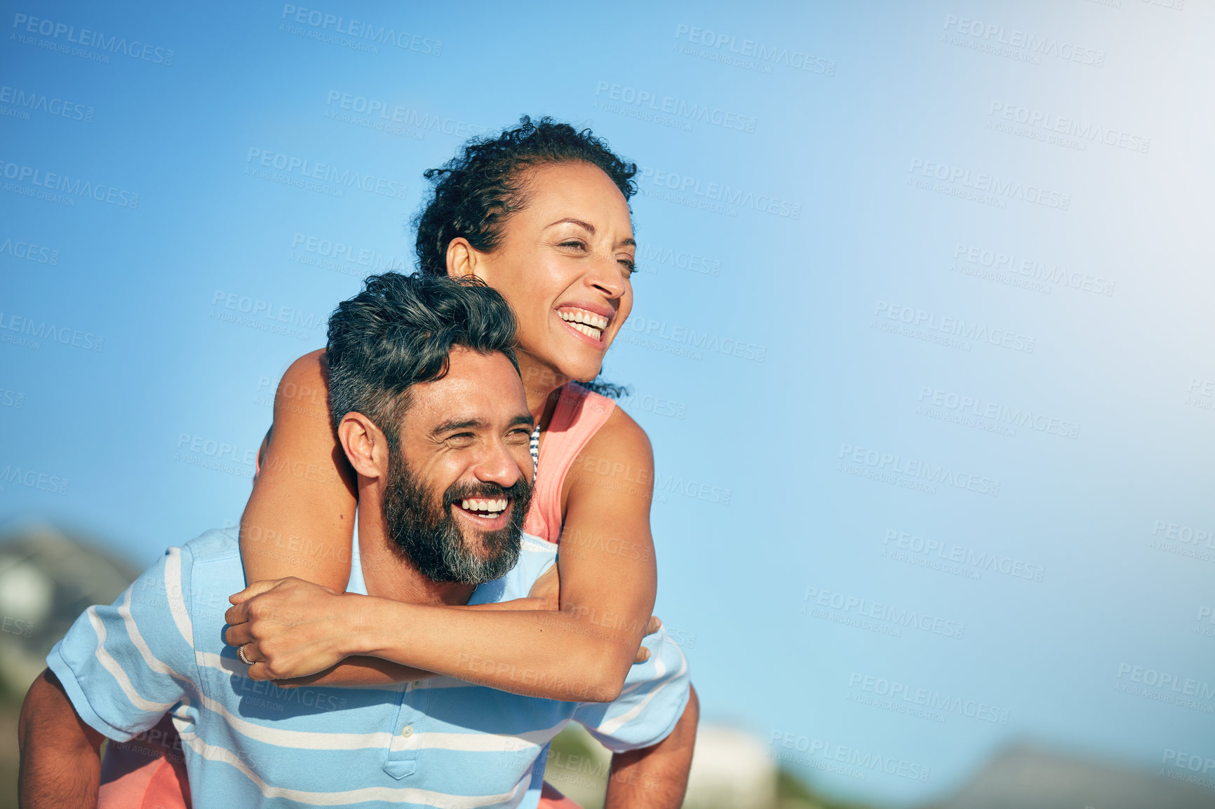 Buy stock photo Shot of a loving couple spending the day at the beach