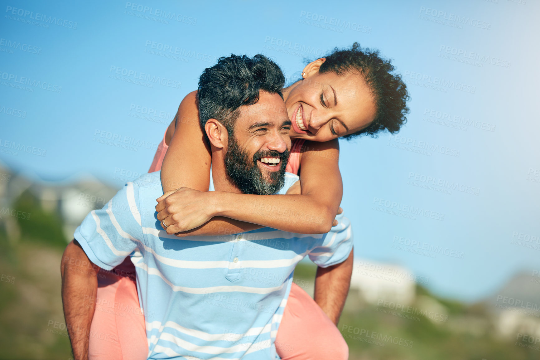 Buy stock photo Piggyback, beach and couple with travel, smile and summer holiday for weekend break and romance. Mature people, space and man with woman, embrace and honeymoon for love, vacation and relationship