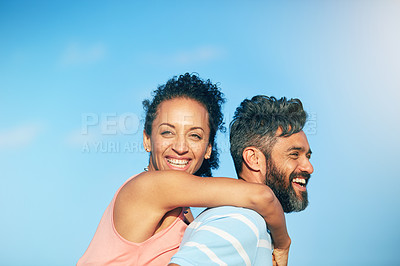 Buy stock photo Shot of a loving couple spending the day at the beach