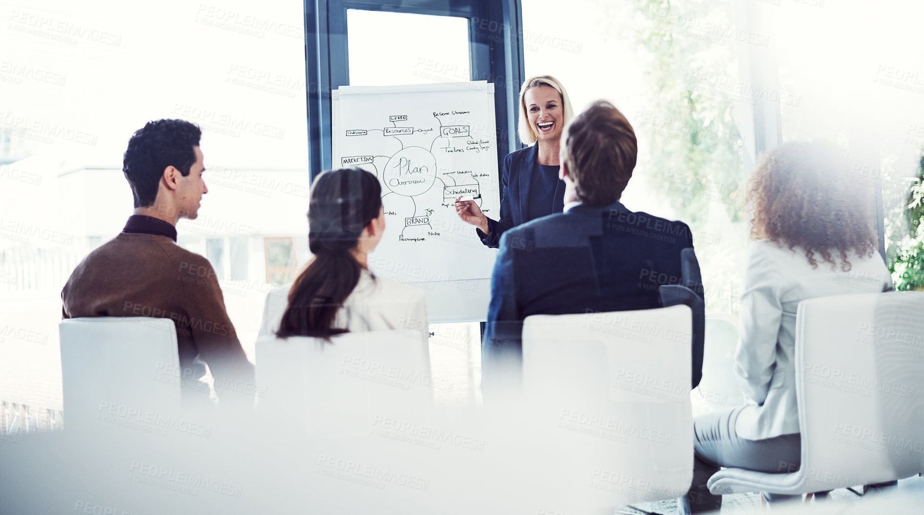 Buy stock photo Cropped shot of a businesswoman giving a presentation to her colleagues in an office