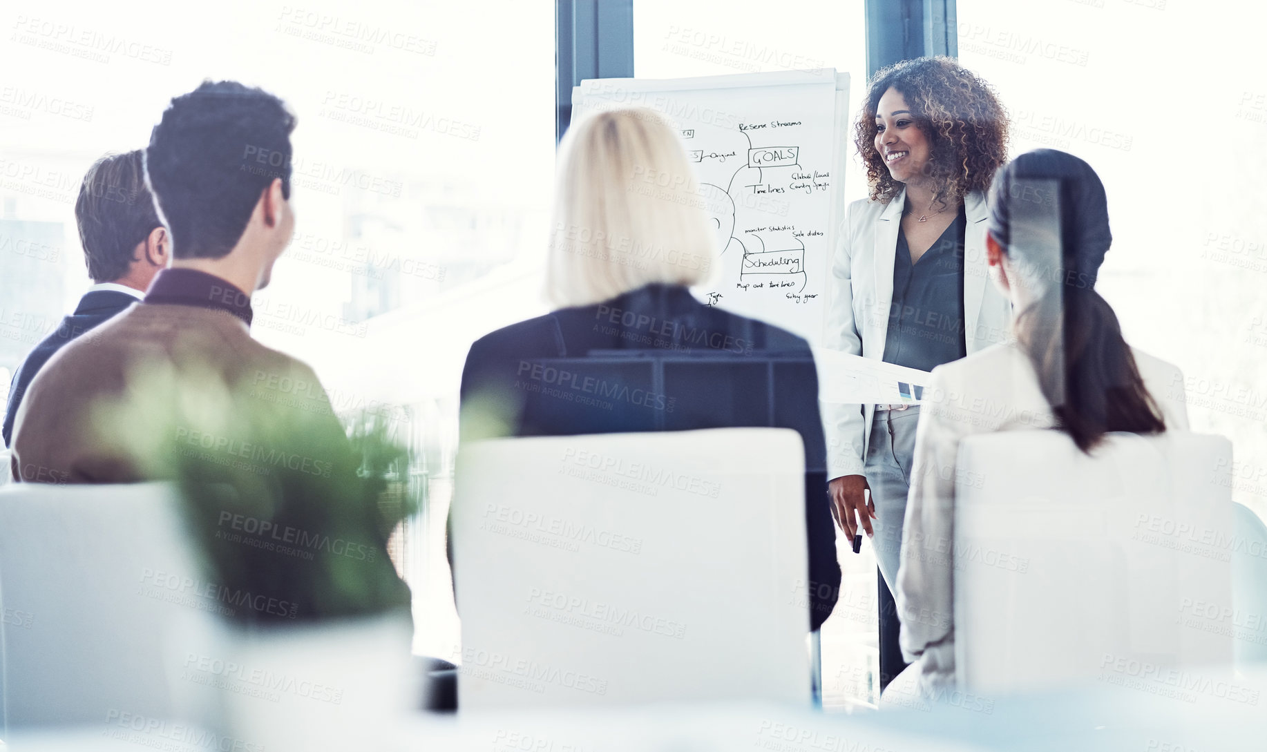 Buy stock photo Cropped shot of a businesswoman giving a presentation to her colleagues in an office