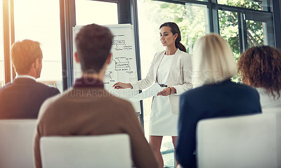 Buy stock photo Cropped shot of a businesswoman giving a presentation to her colleagues in the boardroom