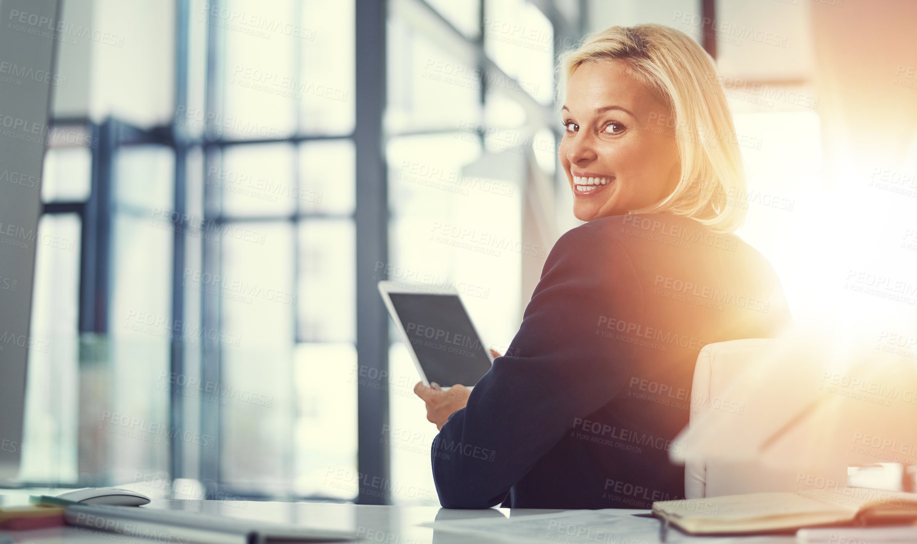 Buy stock photo Shot of a businesswoman using a digital tablet at work