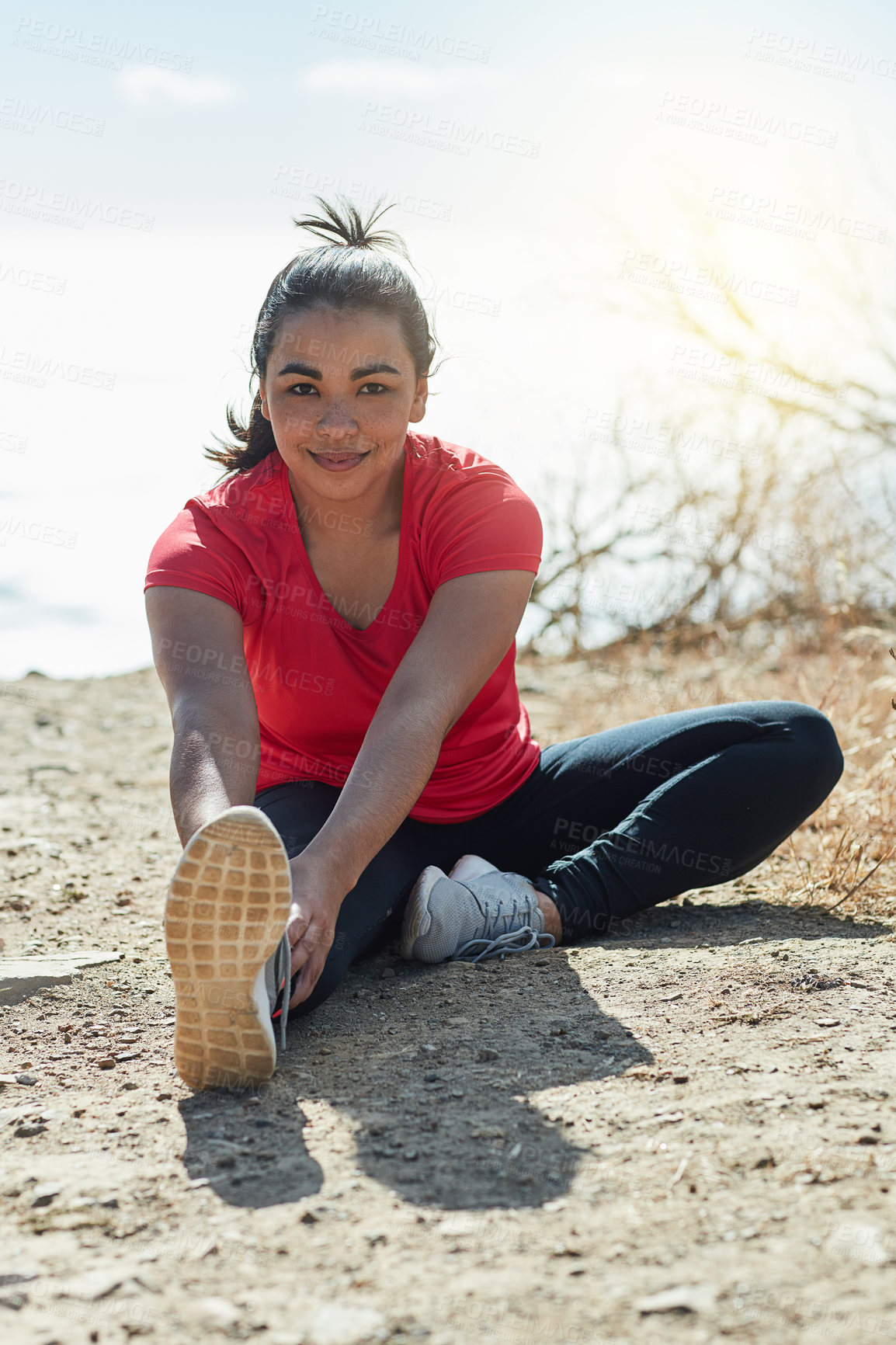 Buy stock photo Full length portrait of an attractive young woman warming up before a workout