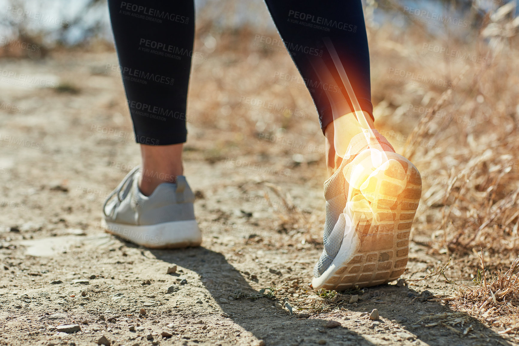 Buy stock photo Back, fitness and running with ankle injury of person outdoor in nature for accident, emergency or mistake. Anatomy, exercise and yellow glow with person closeup on ground for physical activity